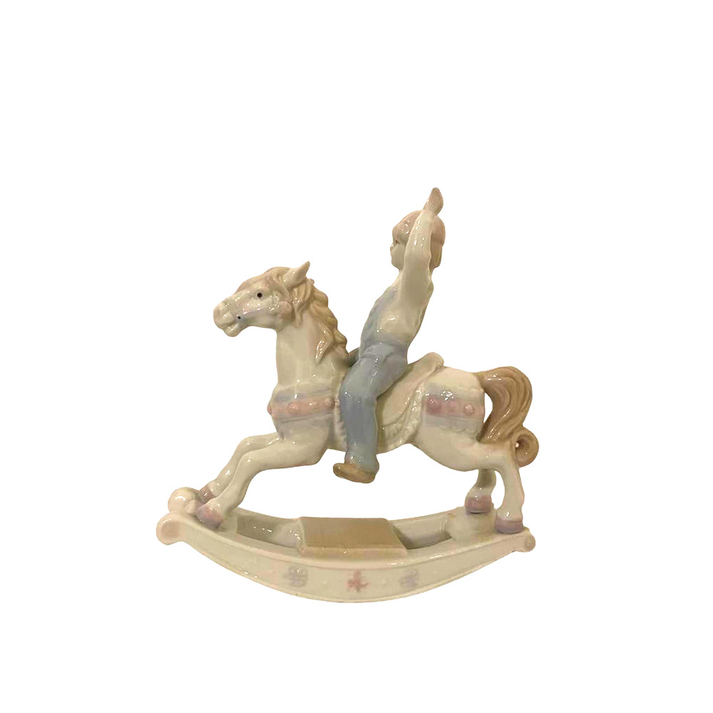 Paul Sebastian ceramic figurine of a boy on a rocking horse